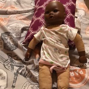 A doll and a fake car seat